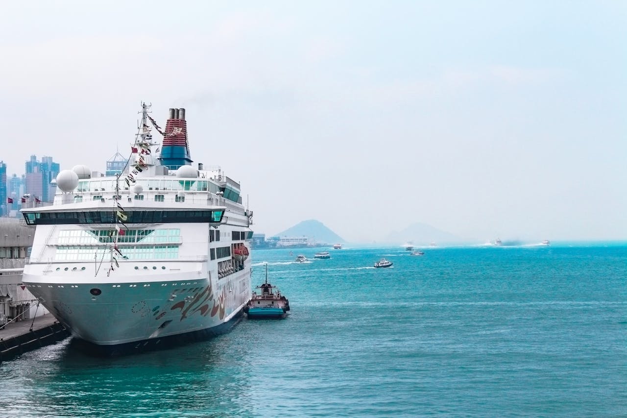 White Cruise Ship Docking in Port